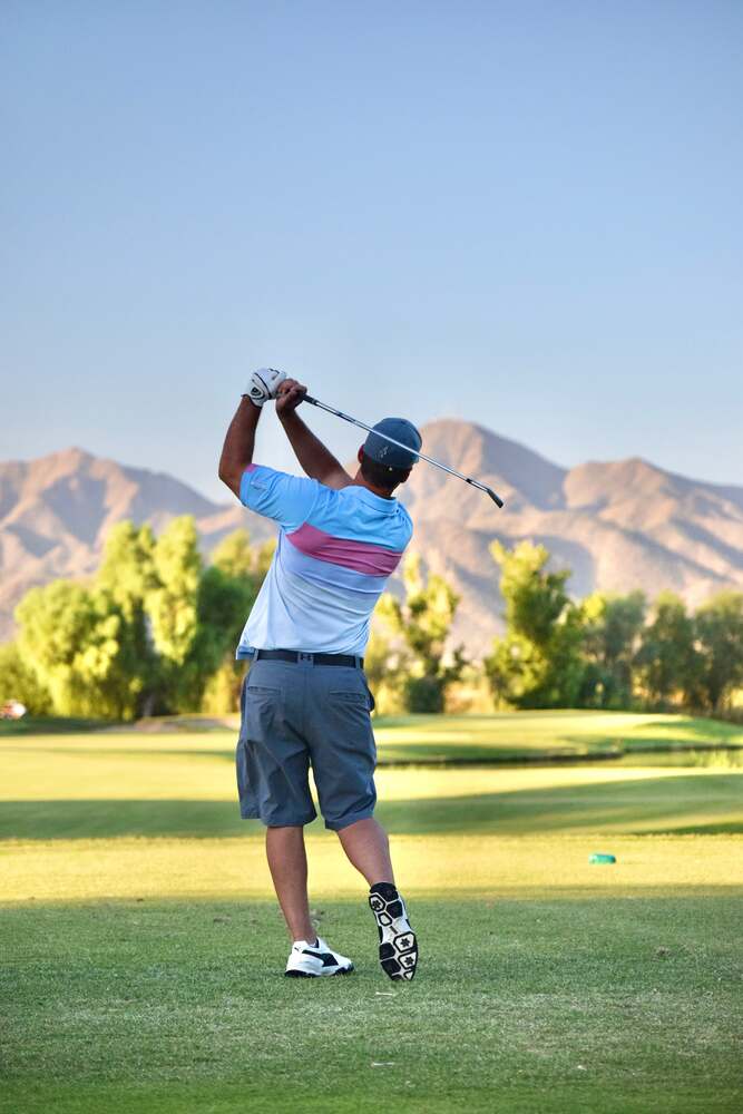 Kory Yule mid-swing — the photograph the JACK logo silhouette was traced from